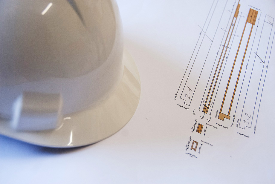 Close-Up of a helmet lying on top of technical drawings