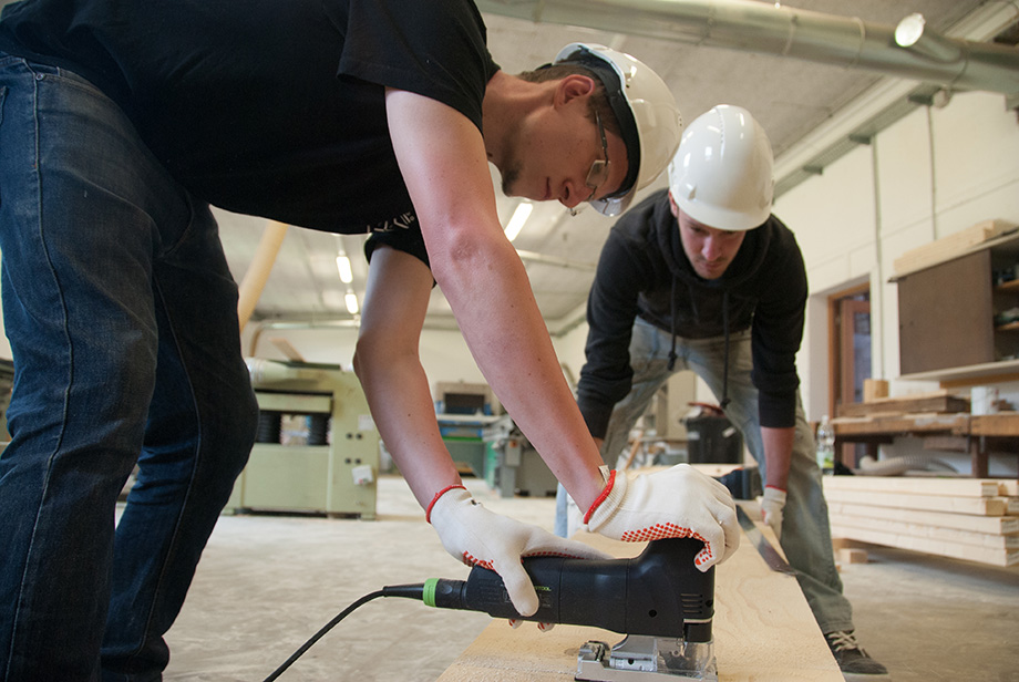 Thomas cutting wood with a jigsaw