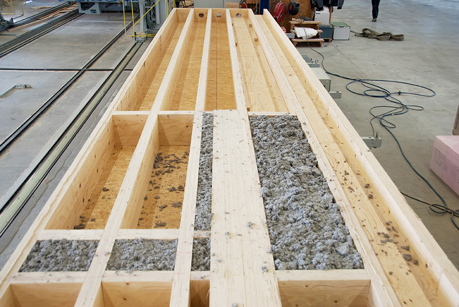 Finished roof frames are being filled with insulation