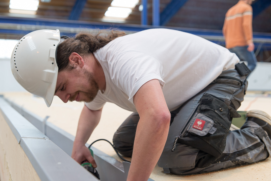 Benedict installing insulation