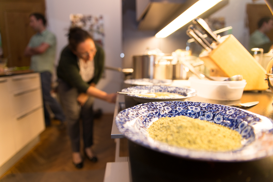 A close-up photo of flour with Karin in the background