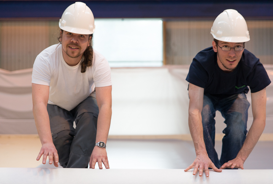 Benedict and Philipp unrolling layers of insulation