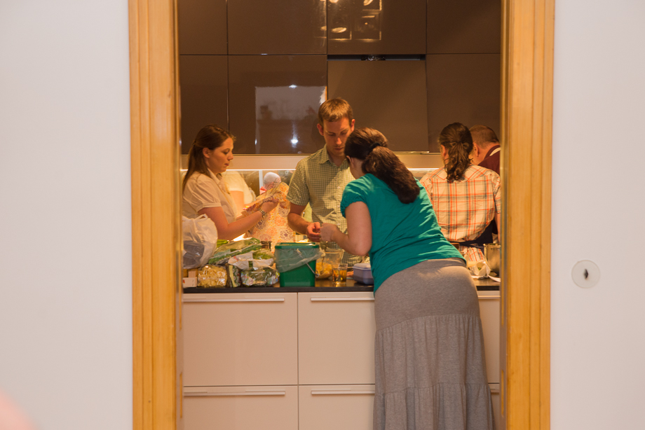 A picture from a distance with a busy kitchen