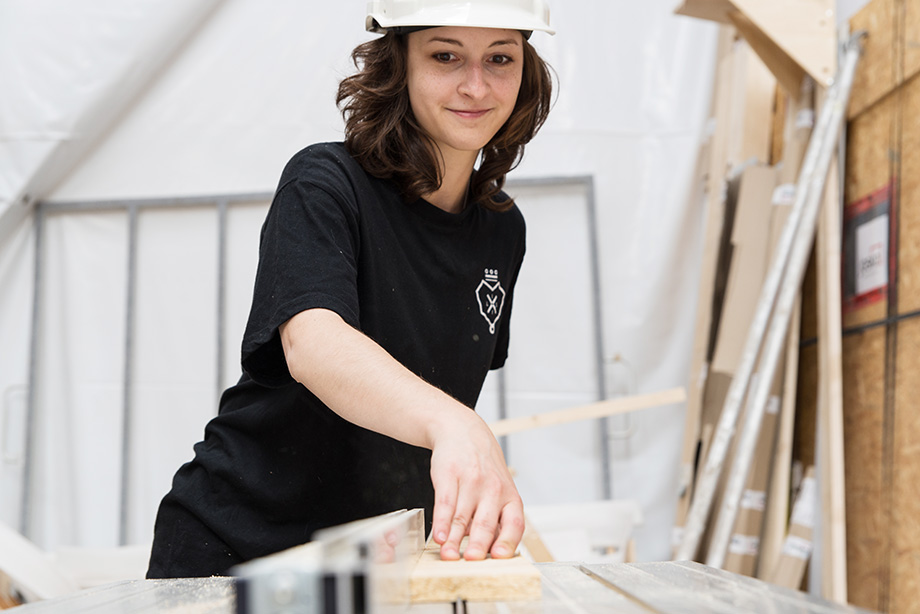 Kathi cutting some wood