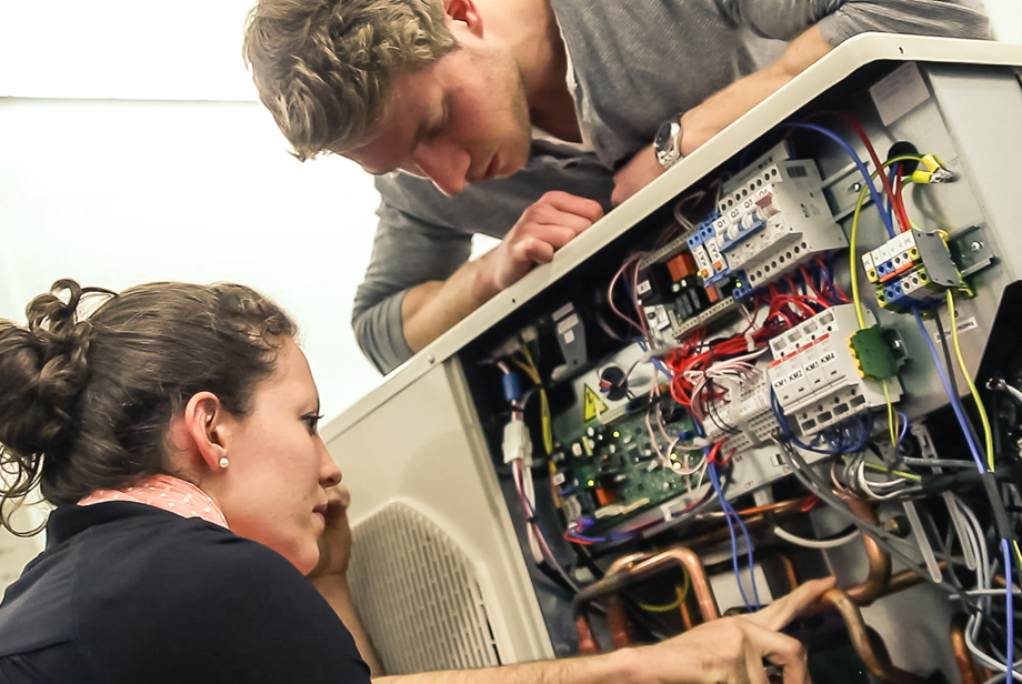 Philipp and Sabrina tinkering with the electronics of our house