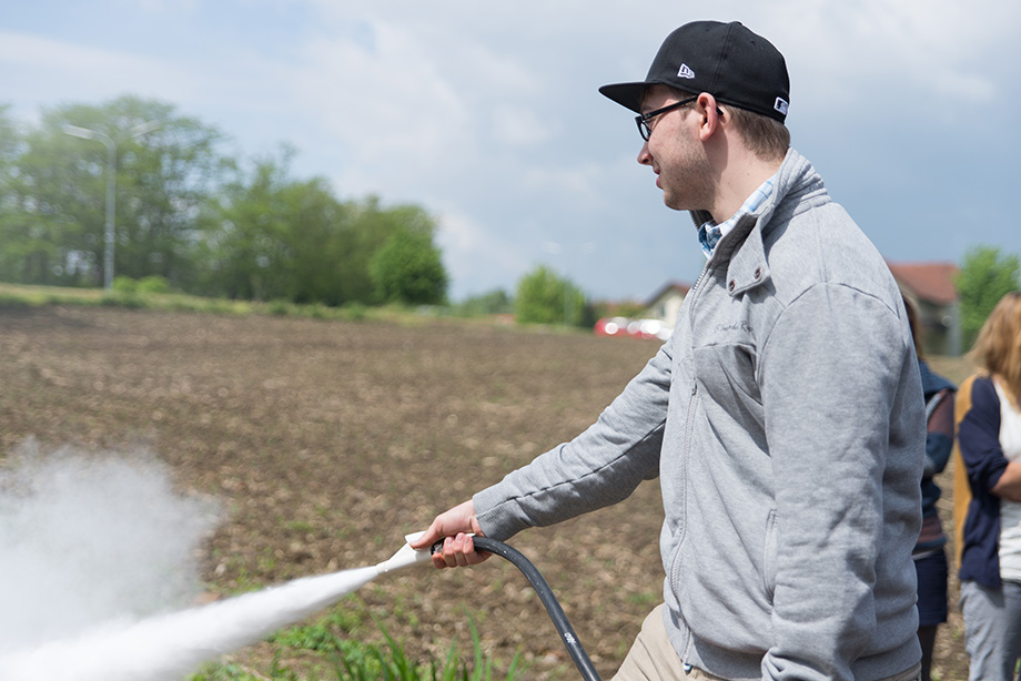 Decathlete spraying a fire extinguisher