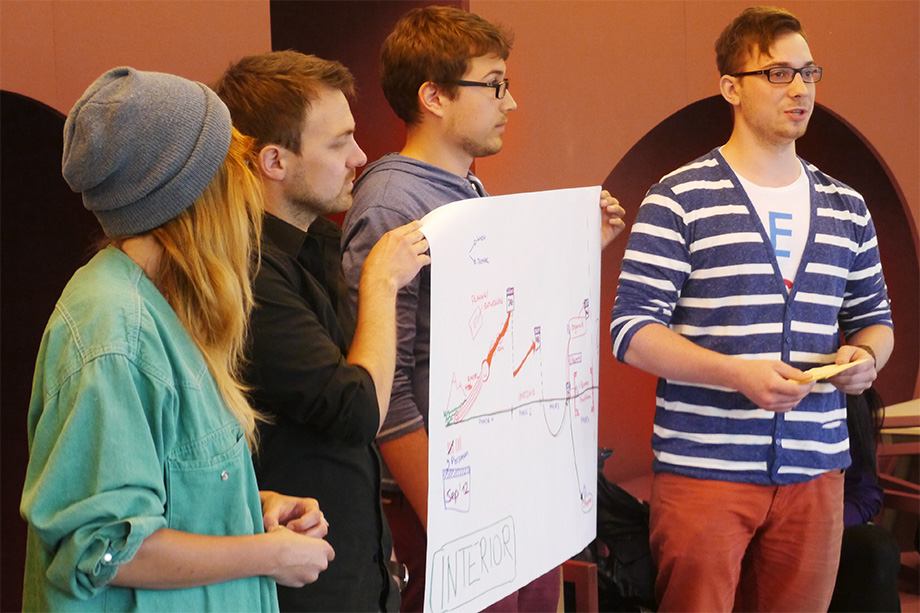 Decathletes presenting a poster during a coaching class