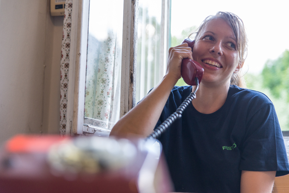 Edith on the phone with an antique telephone headset