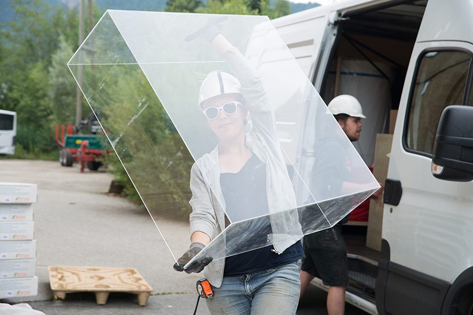 Vroni carrying a massive piece of plexiglass