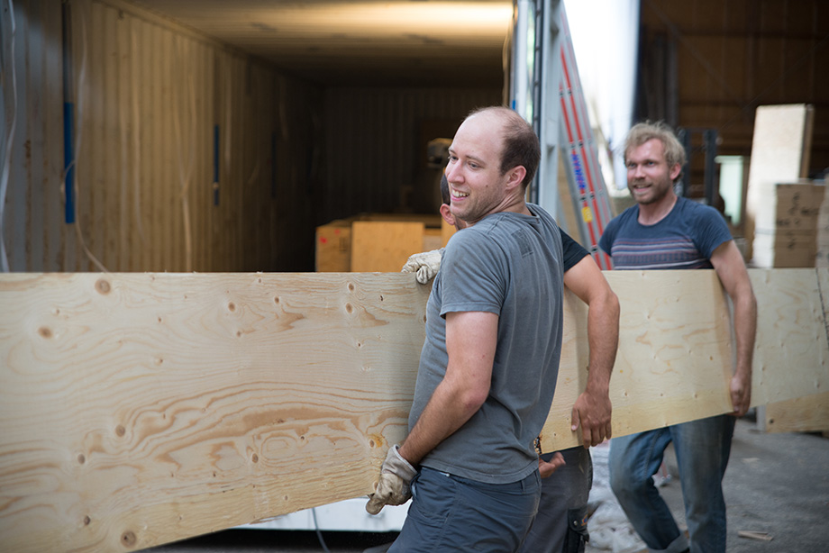 Jakob carrying a giant wooden board