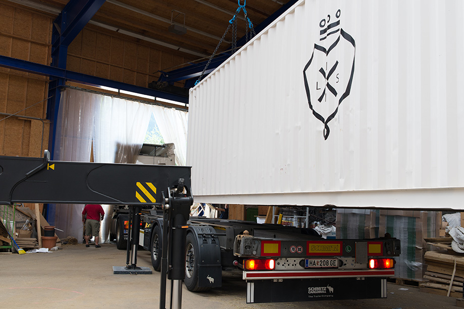 The LISI container being loaded onto a truck