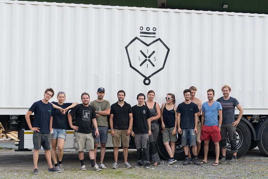 Group picture with a container in the background