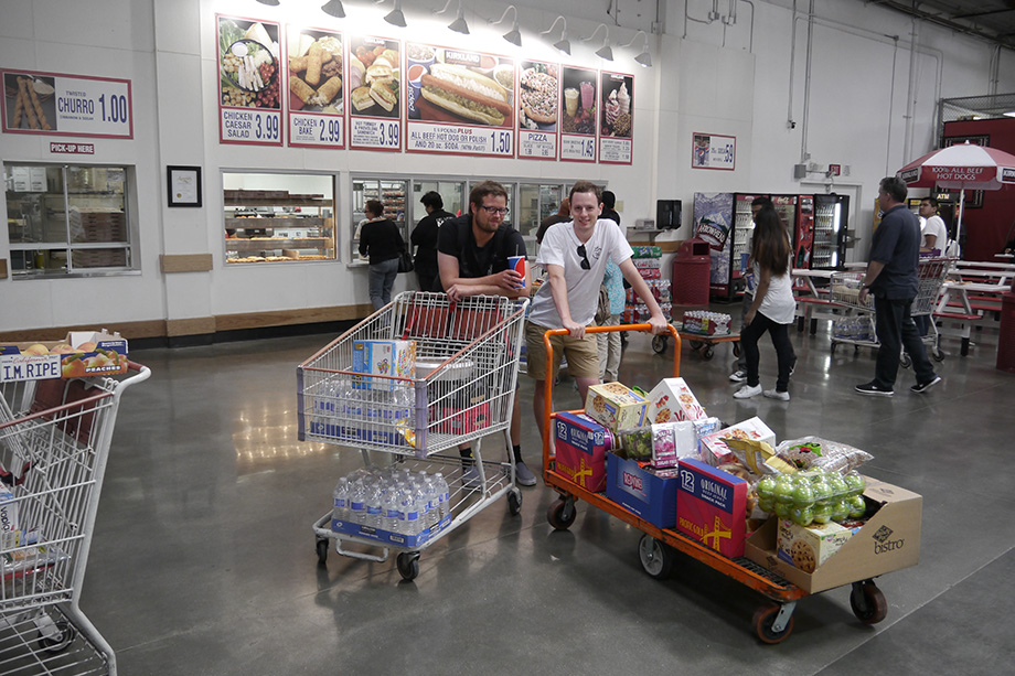 Erwin and Sebastian posing with their shopping carts. One of them being a flat.