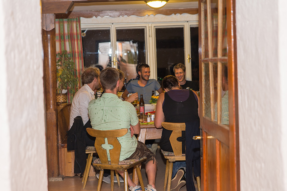 "Stube" is the name of the dining room in Alpine houses. The group has gathered around a table.