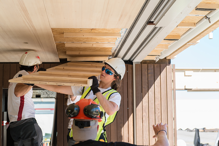 Kathi lifting the ceiling panels