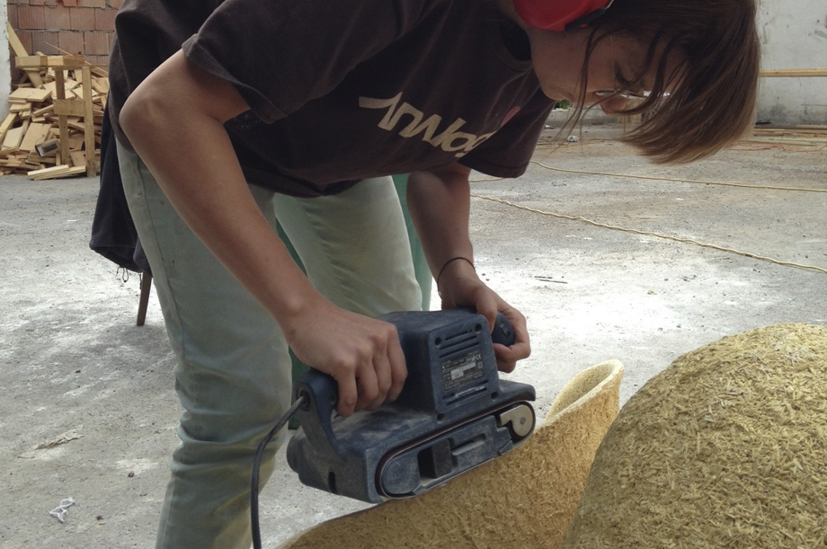 Verena sanding a chair.