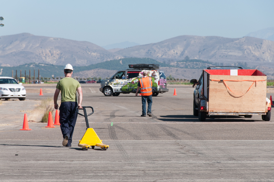 Walking slowly with the pallet truck.