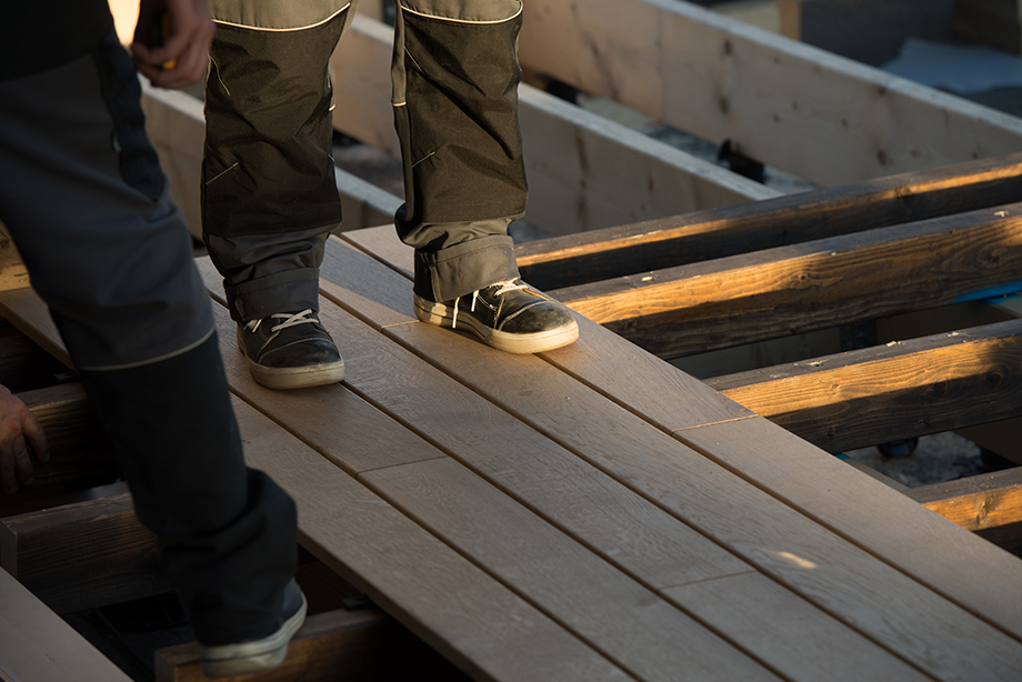 A close up shot of a person standing on the terrace.