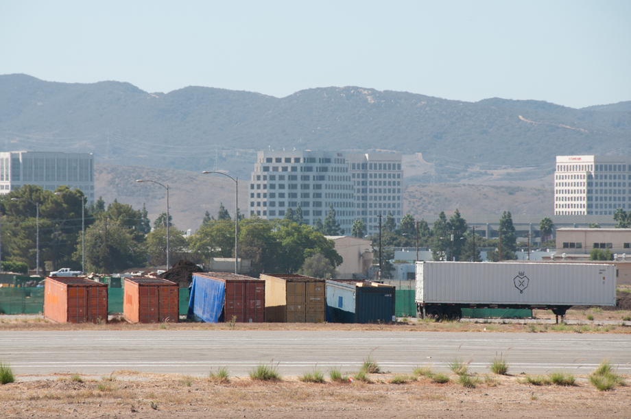 Six LISI containers stored in the distance.