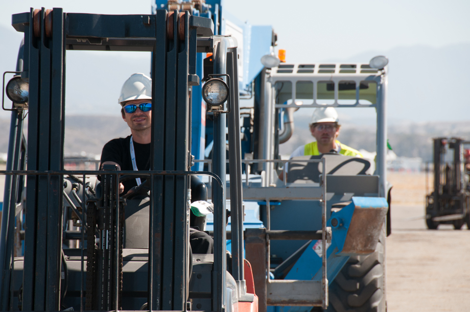 Gregor and Claus driving two forklifts.