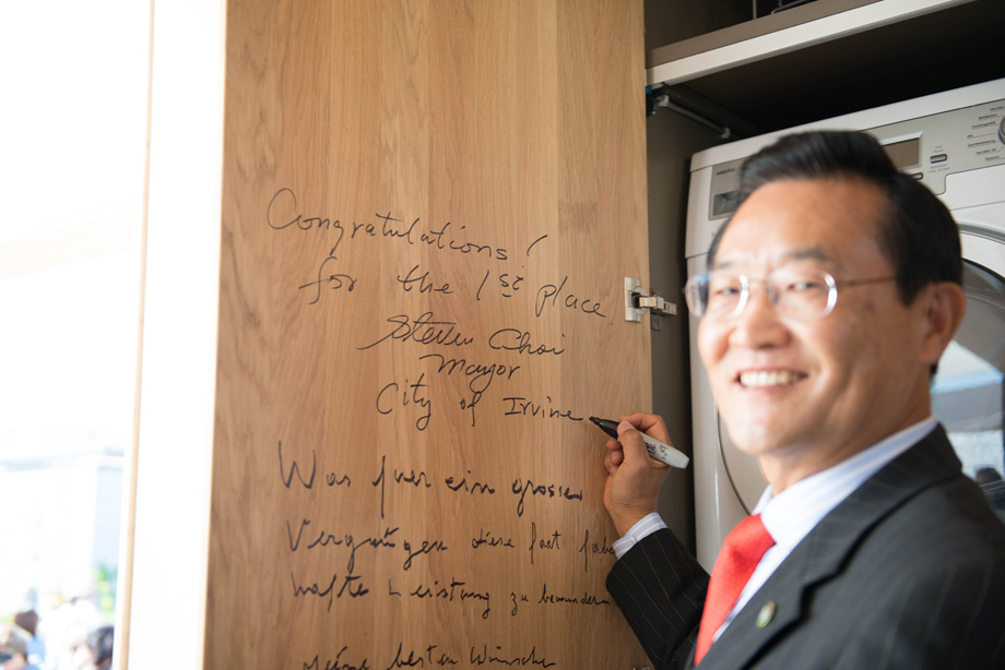 Mayor Choi signs on the inside of our kitchen cabinet doors.