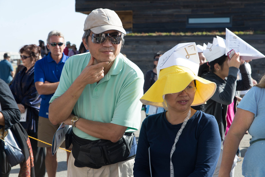 People standing in the sun, wearing the LISI crown.