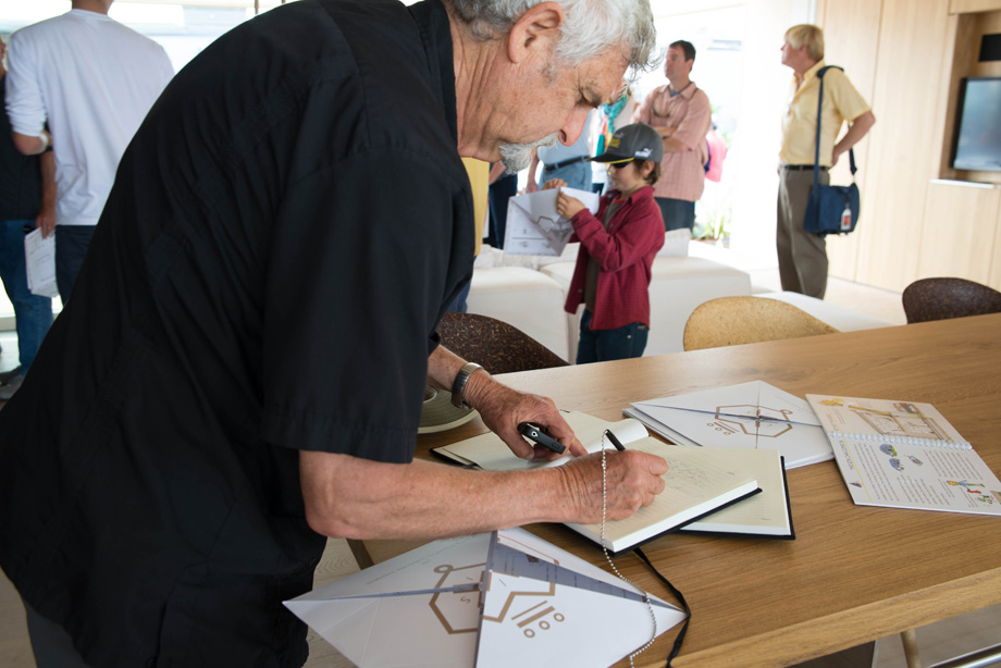 Raymond Neutra, son of famous architect Richard Neutra signing the guest book.