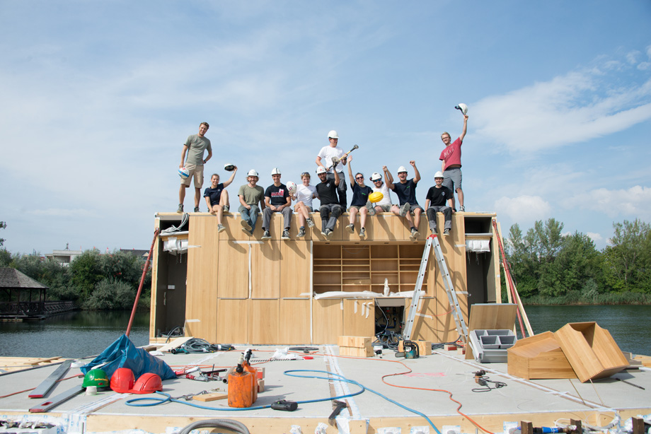 The kitchen core was placed onto the pontoons and all decathletes are cheering.