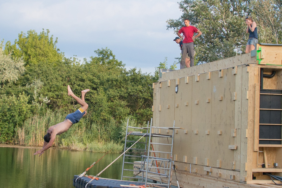 Check this out! Decathlete Adrian is taking a dive from the top of the main core into the lake.