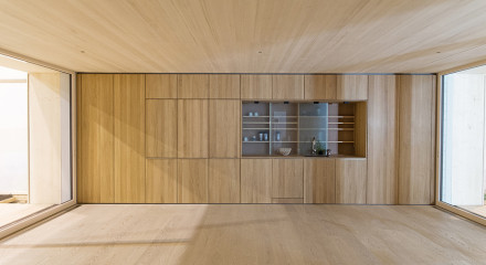 Full frontal view of the kitchen core. On the left are washing machine and dryer. On the right is the wardrobe.