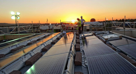 The sun sets over the solar village.