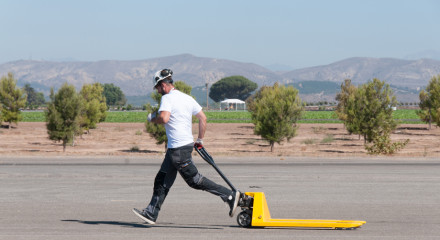 Decathlete Dieter running with the palette trolley.